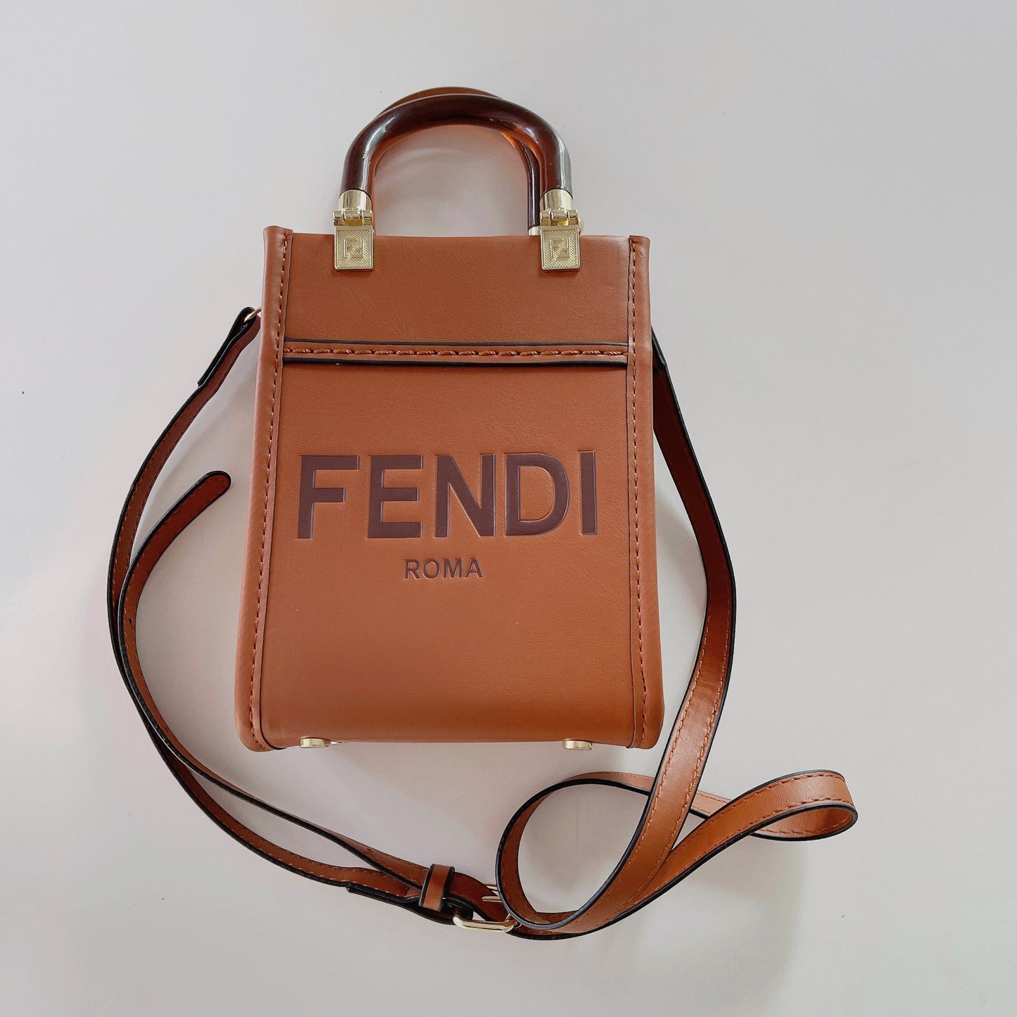 Klassisk mulepose med crossbody-strop