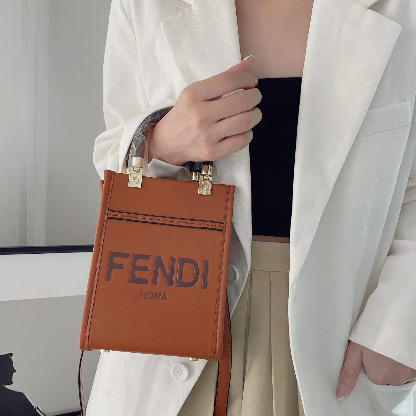 Klassisk mulepose med crossbody-strop