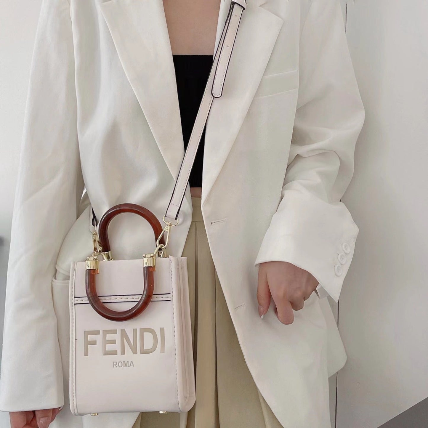 Klassisk mulepose med crossbody-strop