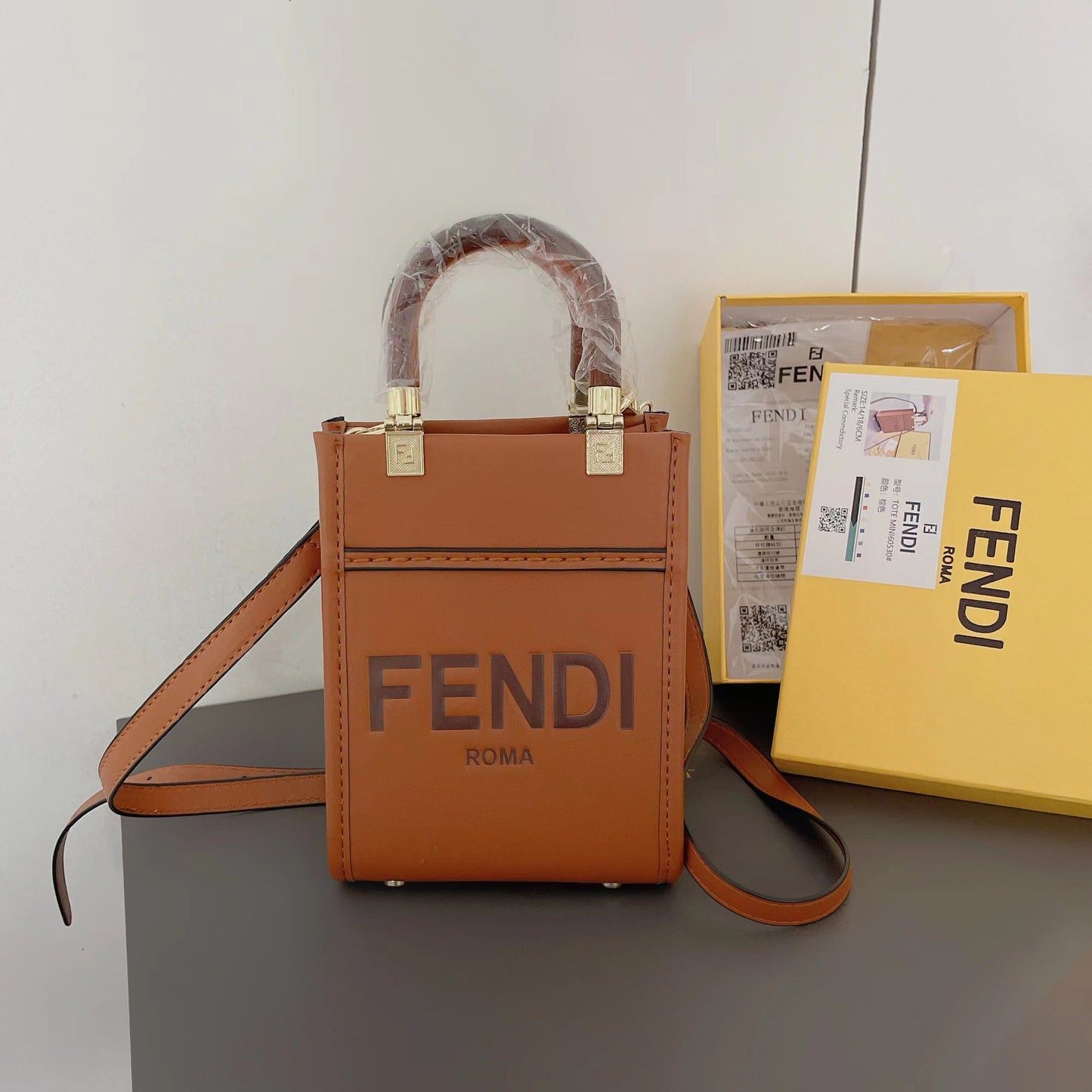 Klassisk mulepose med crossbody-strop